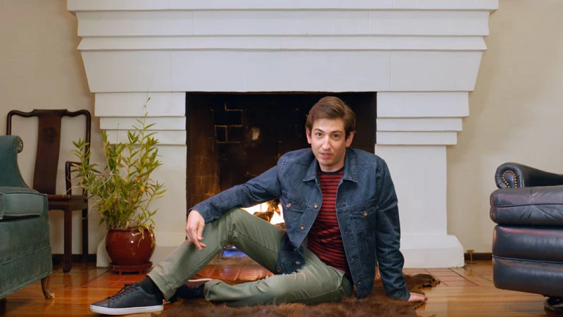 The man in front of a fireplace 